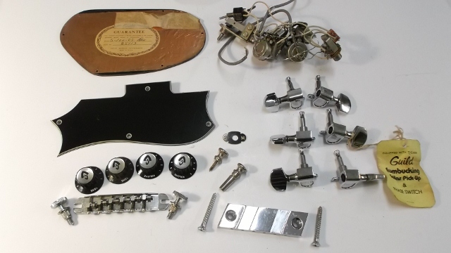 Vintage Guild guitar hardware kit with tuners, bridge, knobs, pickguard, harness, and controls